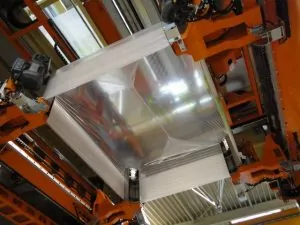 Image of Stretch wrapping and hooding process in stretch hooding machine | Polythene Manufacturers | Polystar Plastics